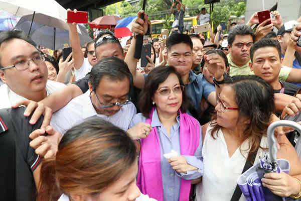 Ousted Supreme Court Chief Justice Lourdes Sereno emerges from the Supreme Court to meet with her supporters in Manila